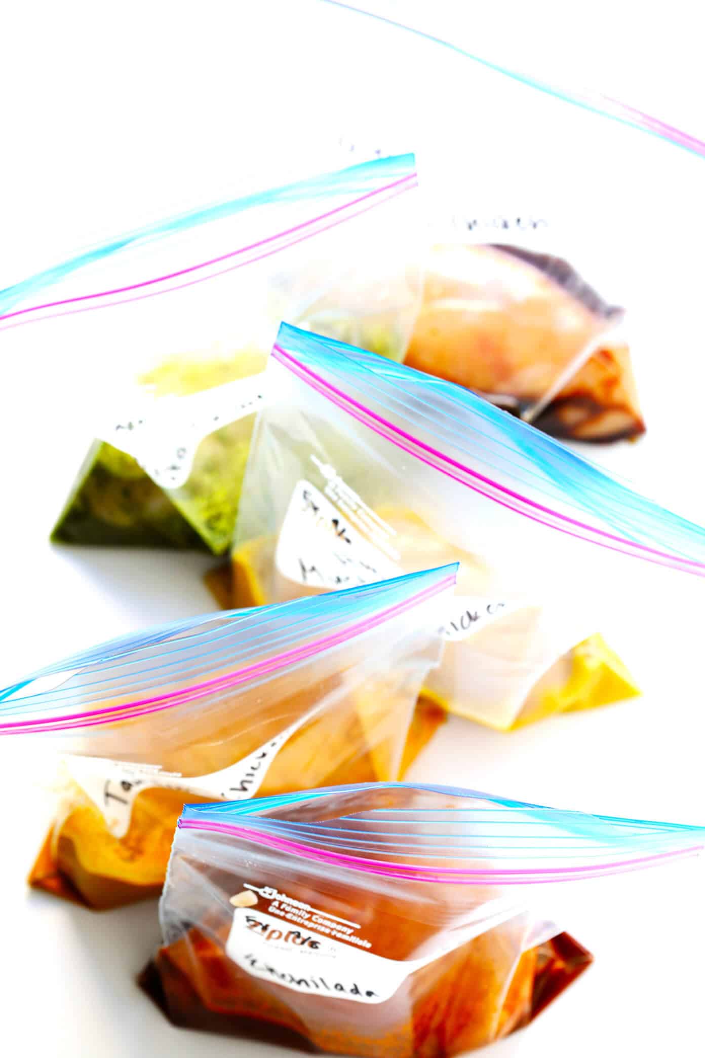 These 5 Easy Chicken Marinade Recipes -- Teriyaki, Enchilada, Tandoori, Honey Mustard and Pesto -- are freezer-friendly, perfect for #mealprep, naturally #glutenfree, and SO delicious. Use them for grilling, baking, stir-frying, or however you prefer! | gimmesomeoven.com #chicken #healthy #mealprep #dinner #recipe #marinade Meal Prep Chicken Marinade Recipes