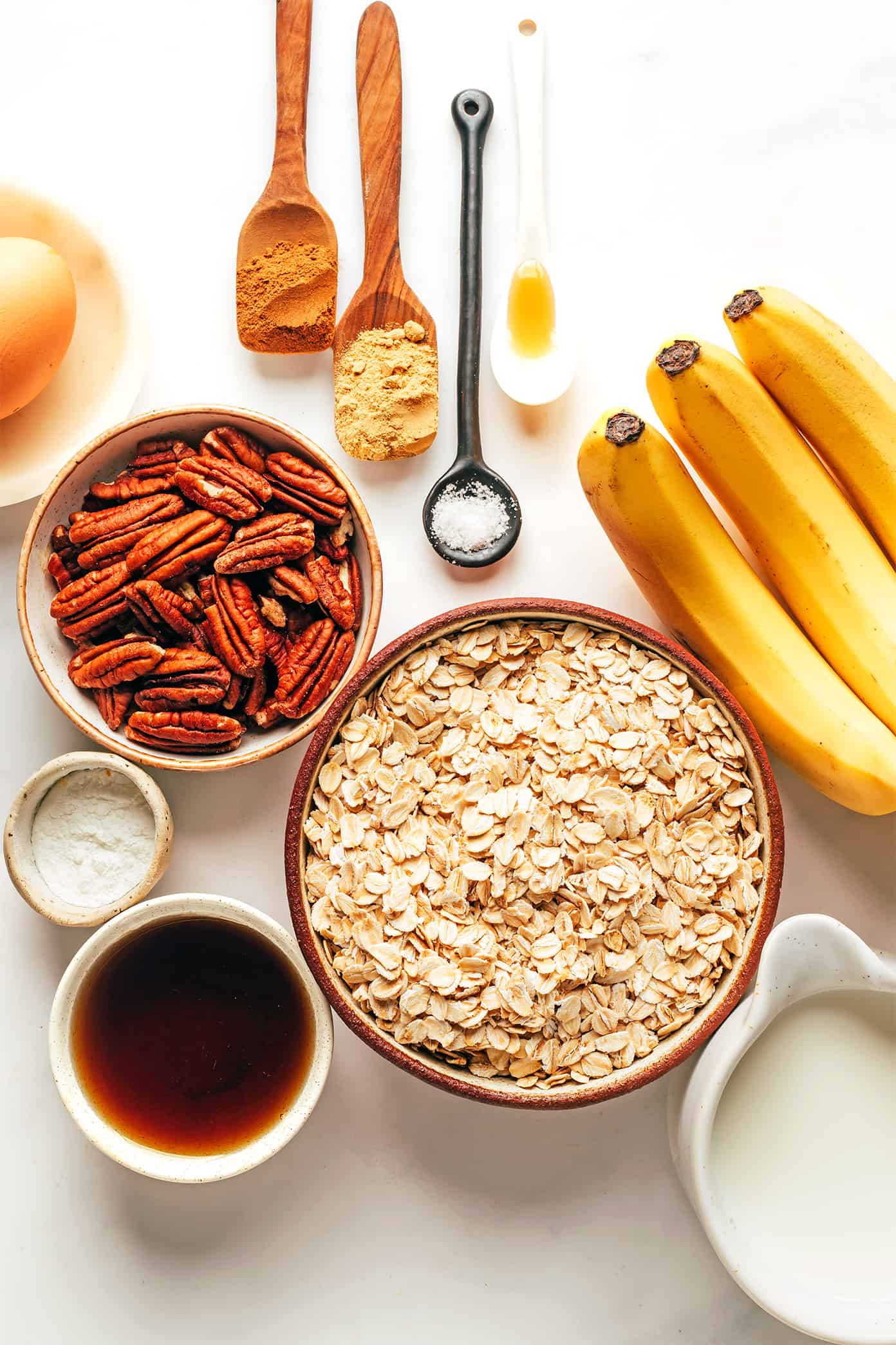 This banana baked oatmeal cups recipe is easy to make, naturally gluten-free, and perfect for healthy grab-and-go breakfast and snacks. Feel free to add in nuts, chocolate chips, raisins or coconut if you'd like too. And these oat cups freeze well if you'd like to do some meal prep for make ahead breakfasts. | gimmesomeoven.com Banana Baked Oatmeal Cups Ingredients