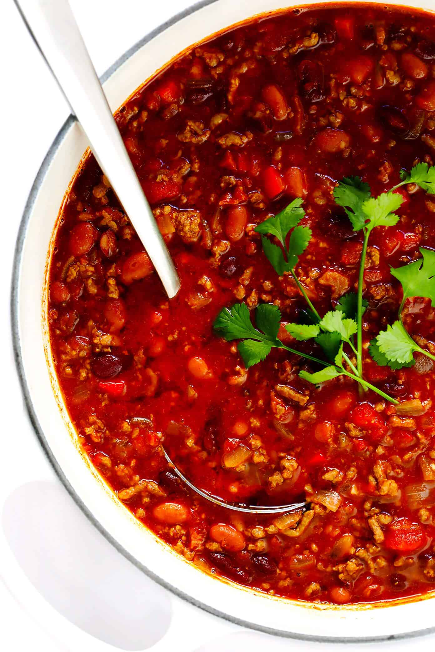 The BEST chili recipe -- made with beef, beans, veggies and the most deliciously seasoned tomato soup broth. Easy to make on the stovetop or in the Instant Pot (pressure cooker) or Crockpot (slow cooker), and always a crowd fave!! | gimmesomeoven.com #chili #soup #stew #dinner #football #mealprep #freezermeal #beef #glutenfree Chili Recipe with Beef