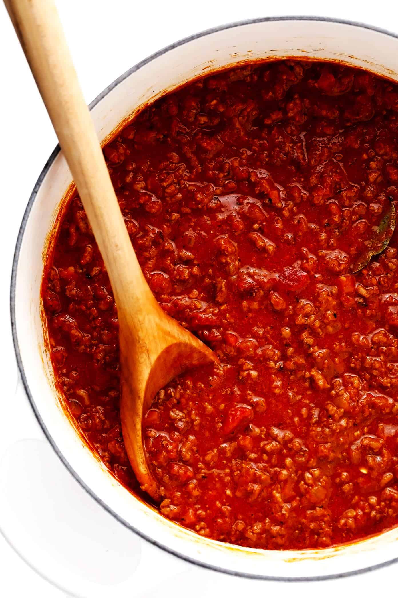 This amazing Bolognese sauce recipe is slow-simmered with a rich tomato base, a delicious blend of beef and pork, and the coziest blend of garlicky herb seasonings. Serve with pasta, gnocchi, or roasted eggplant and enjoy! | gimmesomeoven.com #bolognese #italian #meat #sauce #marinara #pasta #spaghetti #dinner #beef Pot of Bolognese Sauce