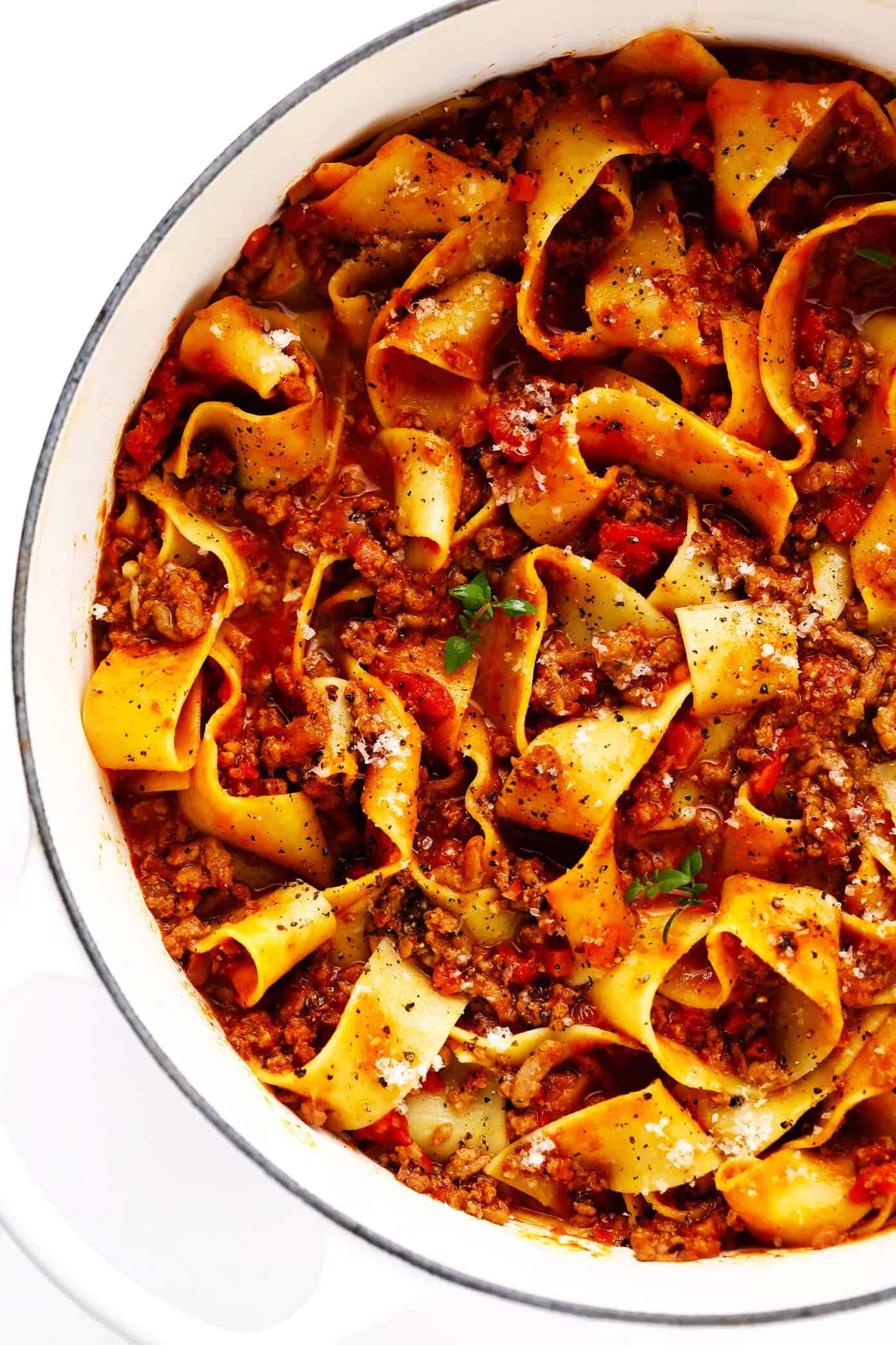 This amazing Bolognese sauce recipe is slow-simmered with a rich tomato base, a delicious blend of beef and pork, and the coziest blend of garlicky herb seasonings. Serve with pasta, gnocchi, or roasted eggplant and enjoy! | gimmesomeoven.com #bolognese #italian #meat #sauce #marinara #pasta #spaghetti #dinner #beef Pasta Bolognese with Pappardelle in Pot