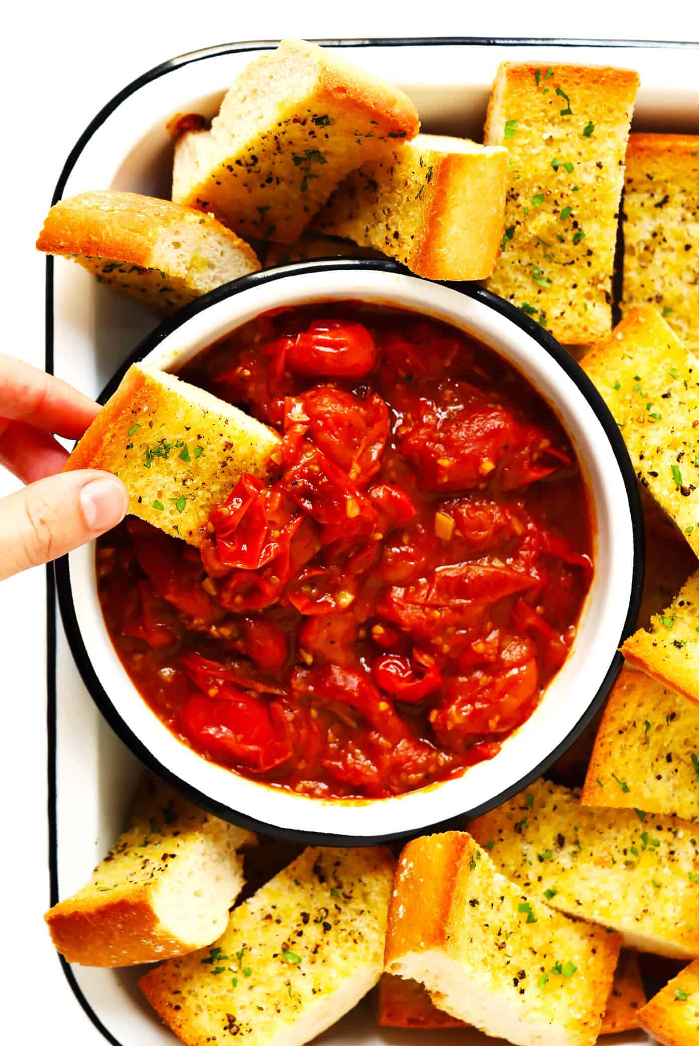 This garlicky Burst Tomato Spread is easy to make with just 5 ingredients and tastes AMAZING served warm with crusty bread. It's the perfect easy appetizer for summertime! | gimmesomeoven.com #tomato #spread #dip #glutenfree #vegan #healthy #appetizer #summer #entertaining Burst Tomato Dip