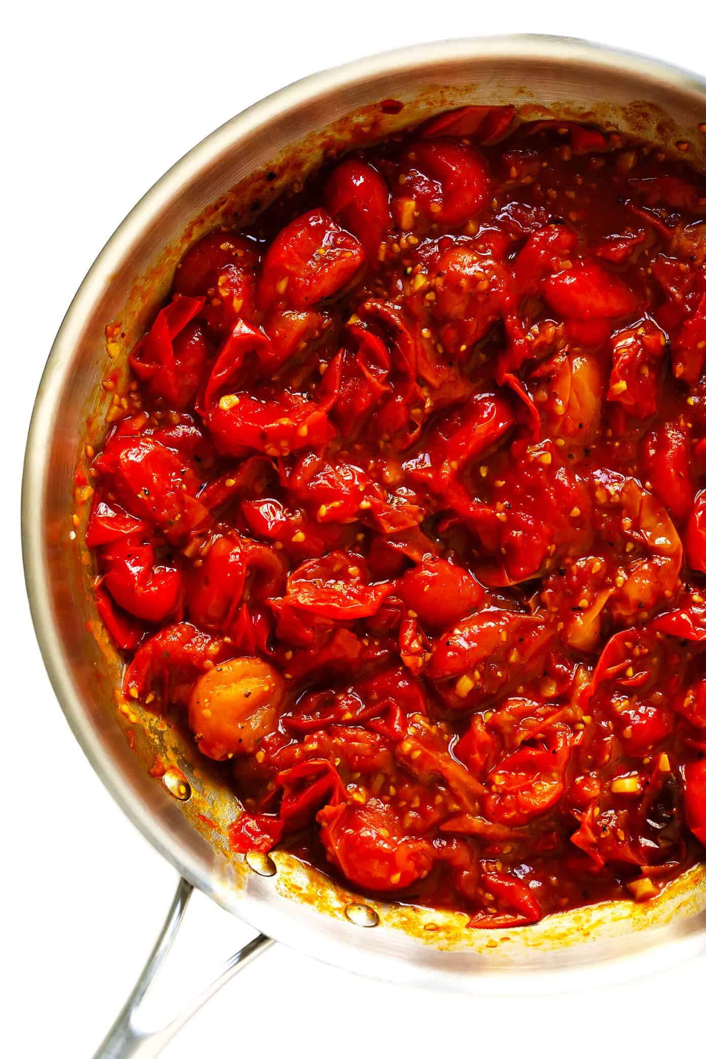 This garlicky Burst Tomato Spread is easy to make with just 5 ingredients and tastes AMAZING served warm with crusty bread. It's the perfect easy appetizer for summertime! | gimmesomeoven.com #tomato #spread #dip #glutenfree #vegan #healthy #appetizer #summer #entertaining How To Make Burst Tomato Spread