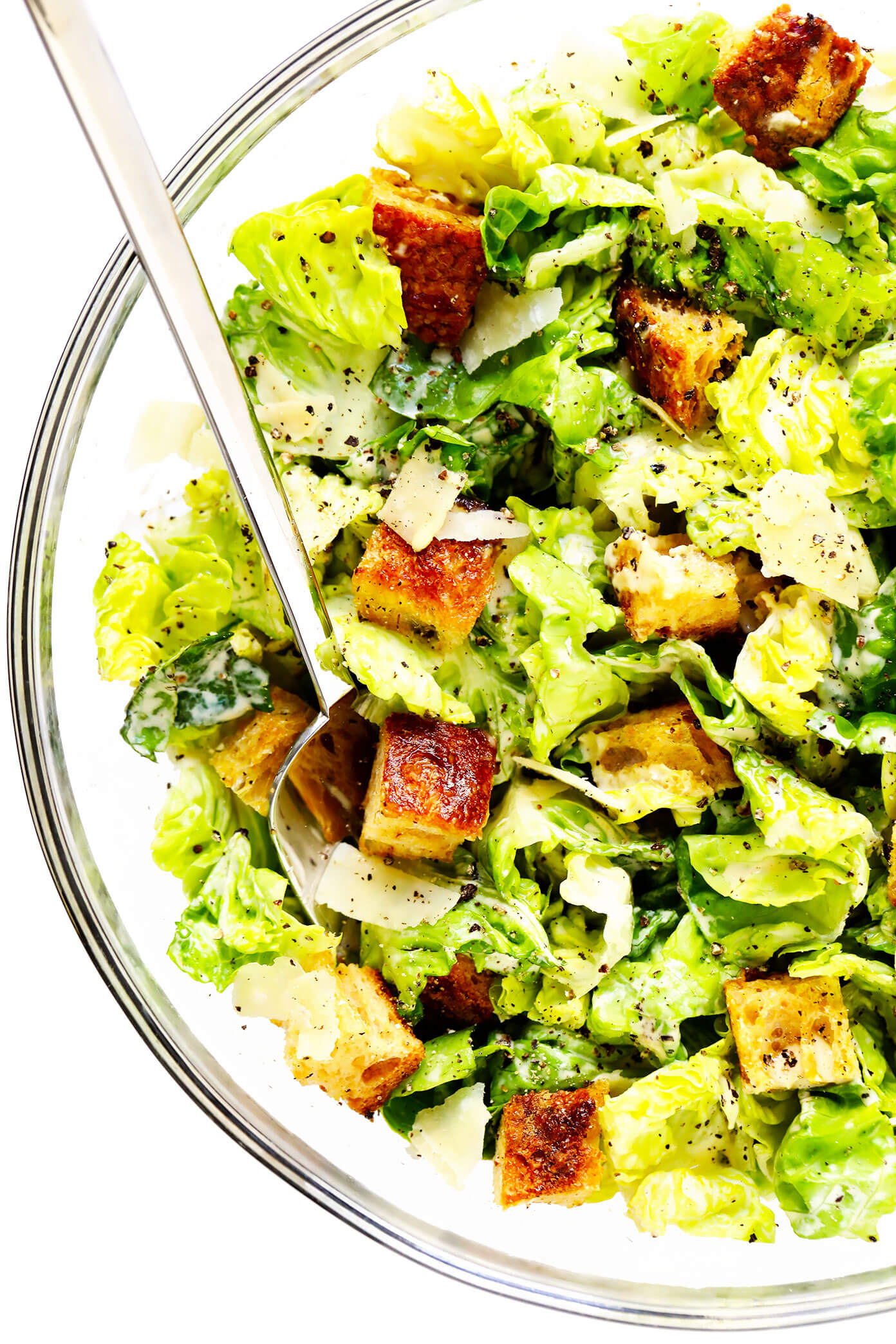 The BEST homemade Caesar salad recipe -- full of crisp lettuce, toasty sourdough croutons, lots of Parmesan cheese, and my all-time favorite homemade Caesar dressing. Feel free to add in some proteins (chicken, shrimp, salmon, etc.) or grill the lettuce too, if you would like! | gimmesomeoven.com #caesar #salad #dressing #homemade #glutenfree #healthy #summer #italian Caesar Salad in Bowl with Homemade Croutons