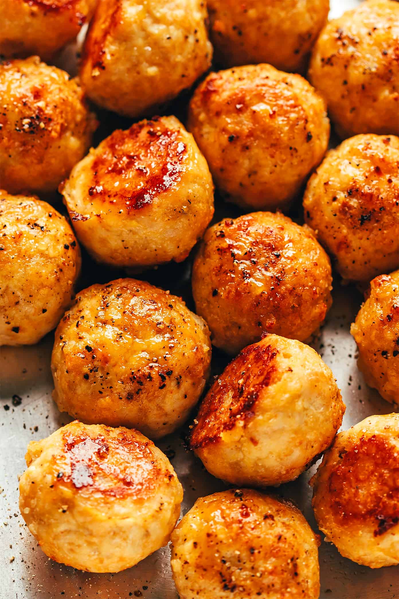 My go-to baked chicken meatballs recipe is easy to make, perfectly moist and tender, and customizable with your favorite seasonings. Serve with Italian marinara, Swedish gravy, Thai curry, Greek tzatziki, buffalo sauce, or whatever sounds best! | gimmesomeoven.com Chicken meatballs