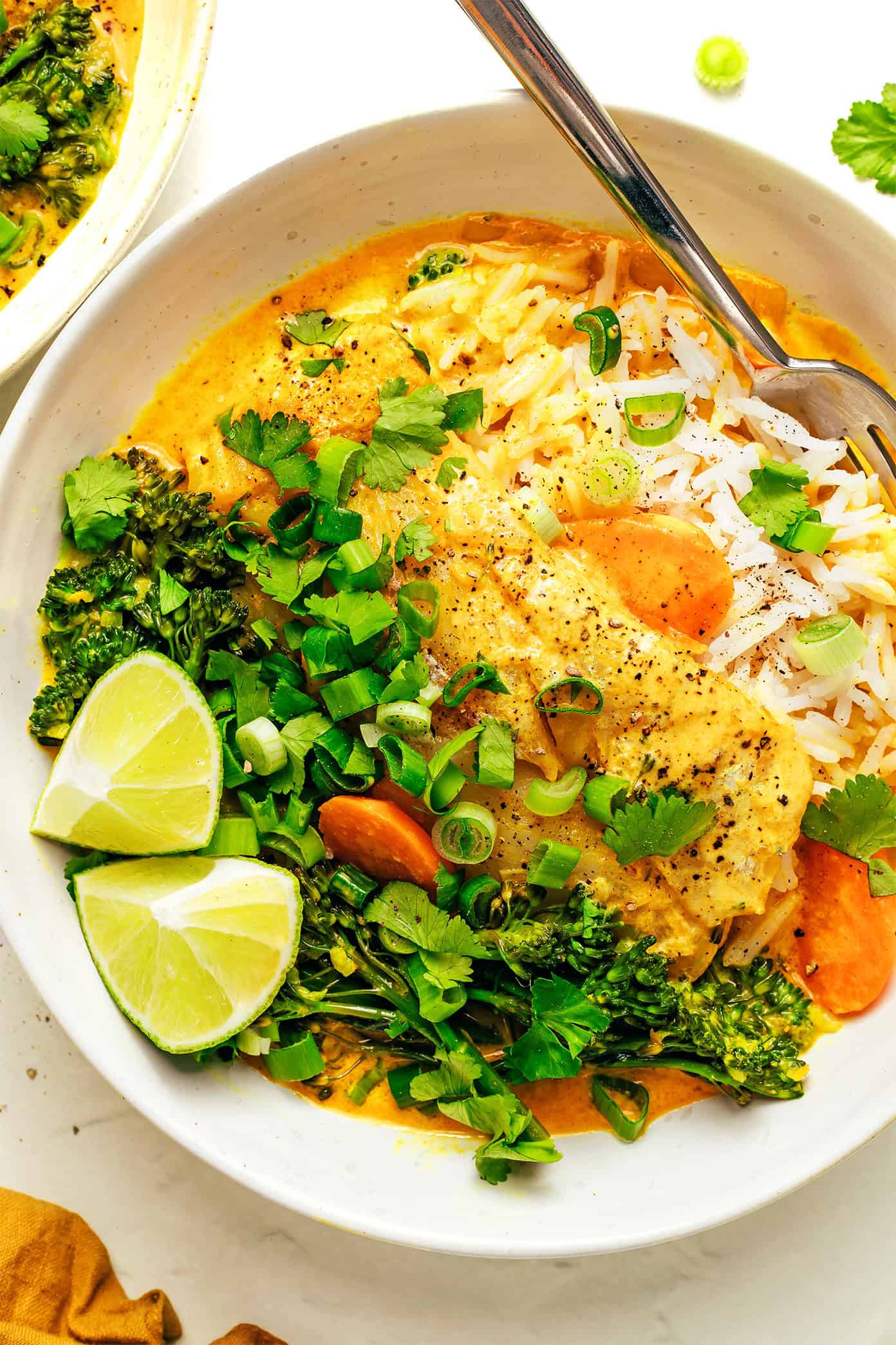 This lovely Thai-inspired curry recipe features tender white fish simmered in a creamy coconut curry broth with veggies. Thai Fish Curry in Bowl