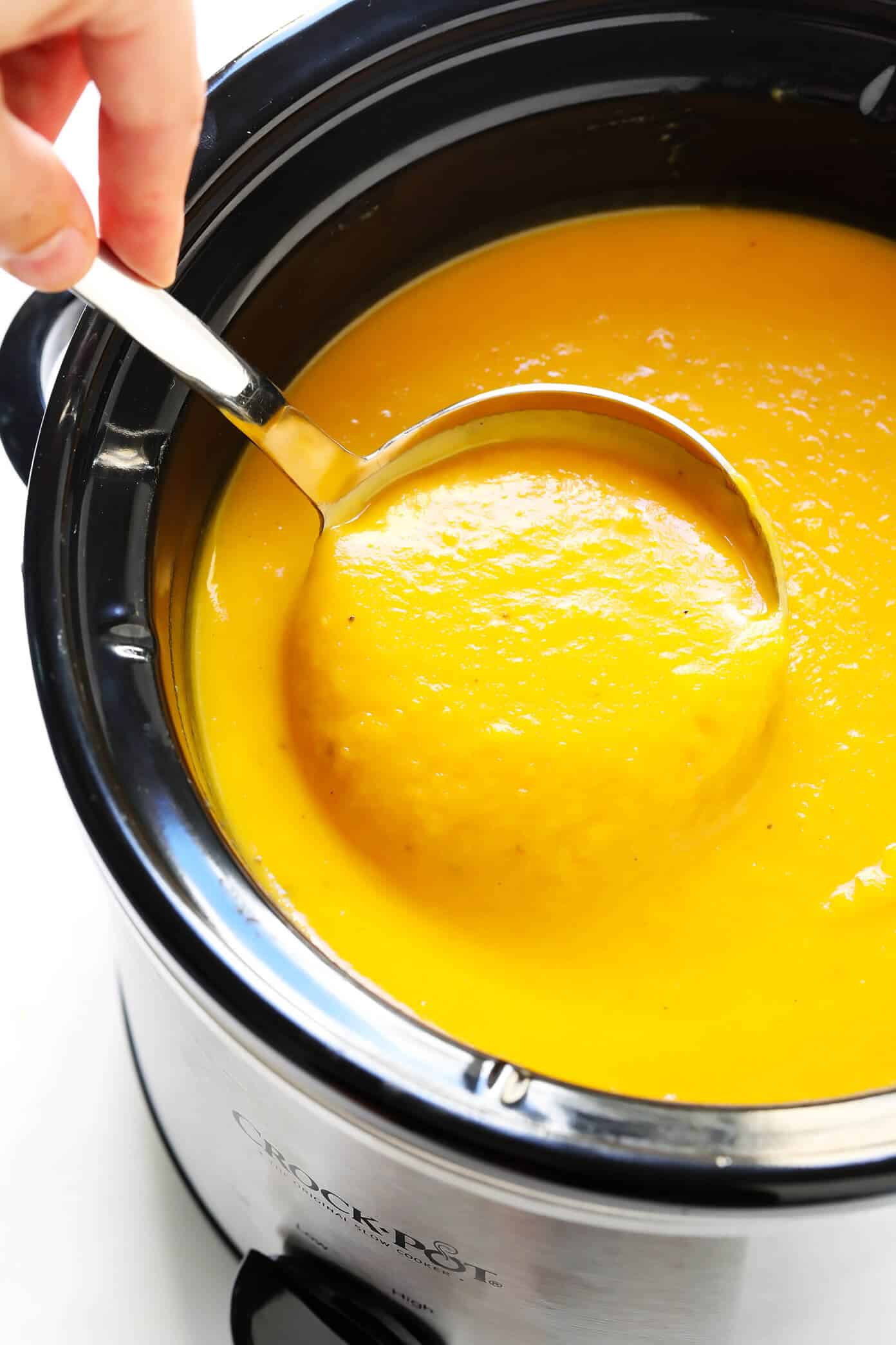 This delicious Butternut Squash Soup recipe is quick and easy to make, loaded up with savory fall vegetables, lightened up with coconut milk (no heavy cream needed), and SO cozy and delicious. Naturally gluten-free, vegetarian, vegan and easy to make in either the Instant Pot, Crock Pot, or on the stovetop. The perfect healthy comfort food dinner recipe for fall or winter! | gimmesomeoven.com Slow Cooker Butternut Squash Soup in Crock Pot