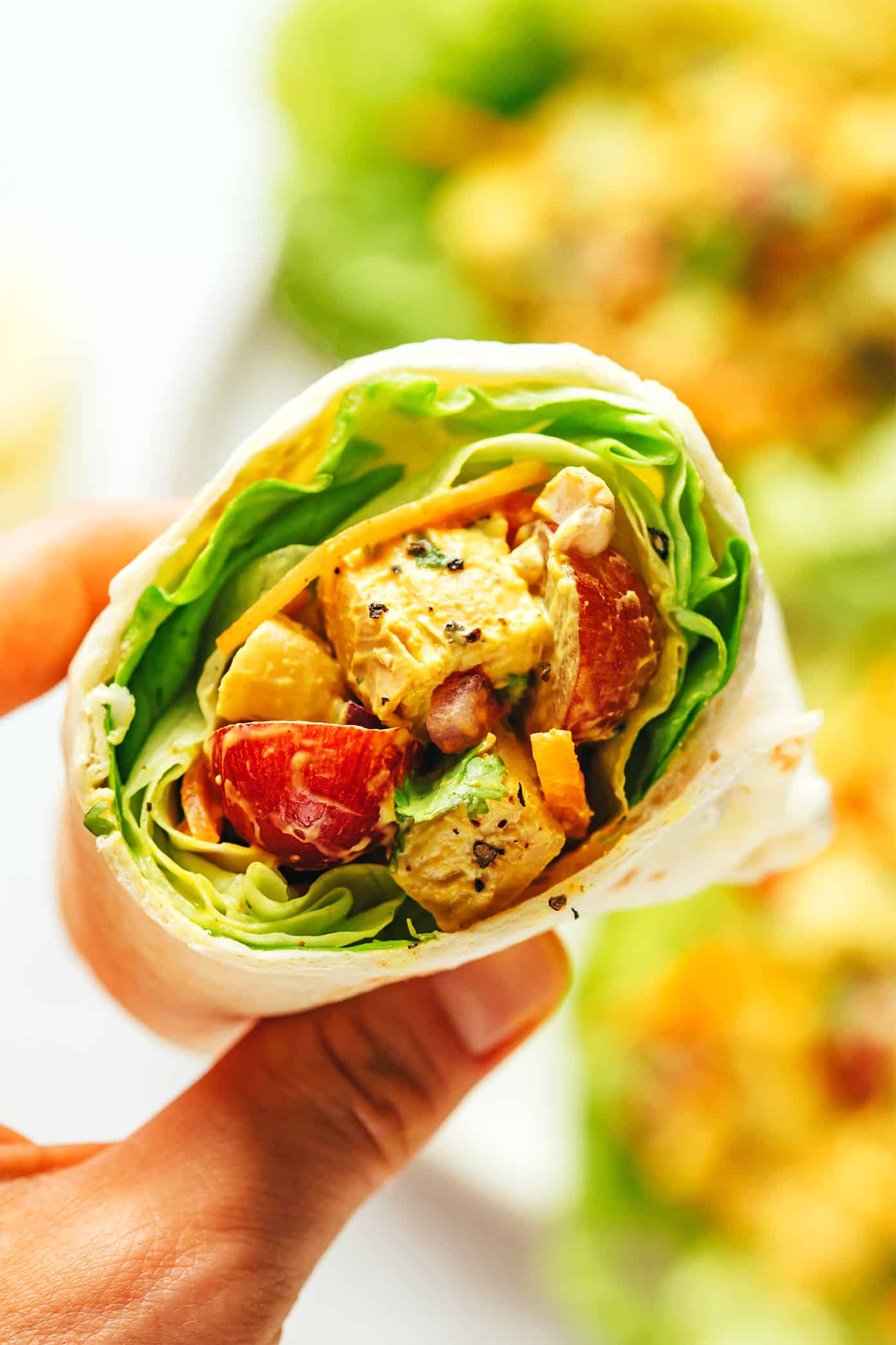 This copycat Trader Joe's curry chicken salad recipe is made with diced chicken, grapes, carrots, cashews, red onions, and a creamy Greek yogurt curry sauce. Serve in sandwiches, lettuce wraps, with crackers for dipping, or whatever sounds good! It's a high protein recipe that's perfect for meal prep and always hits the spot. | gimmesomeoven.com Curry Chicken Salad Wrap