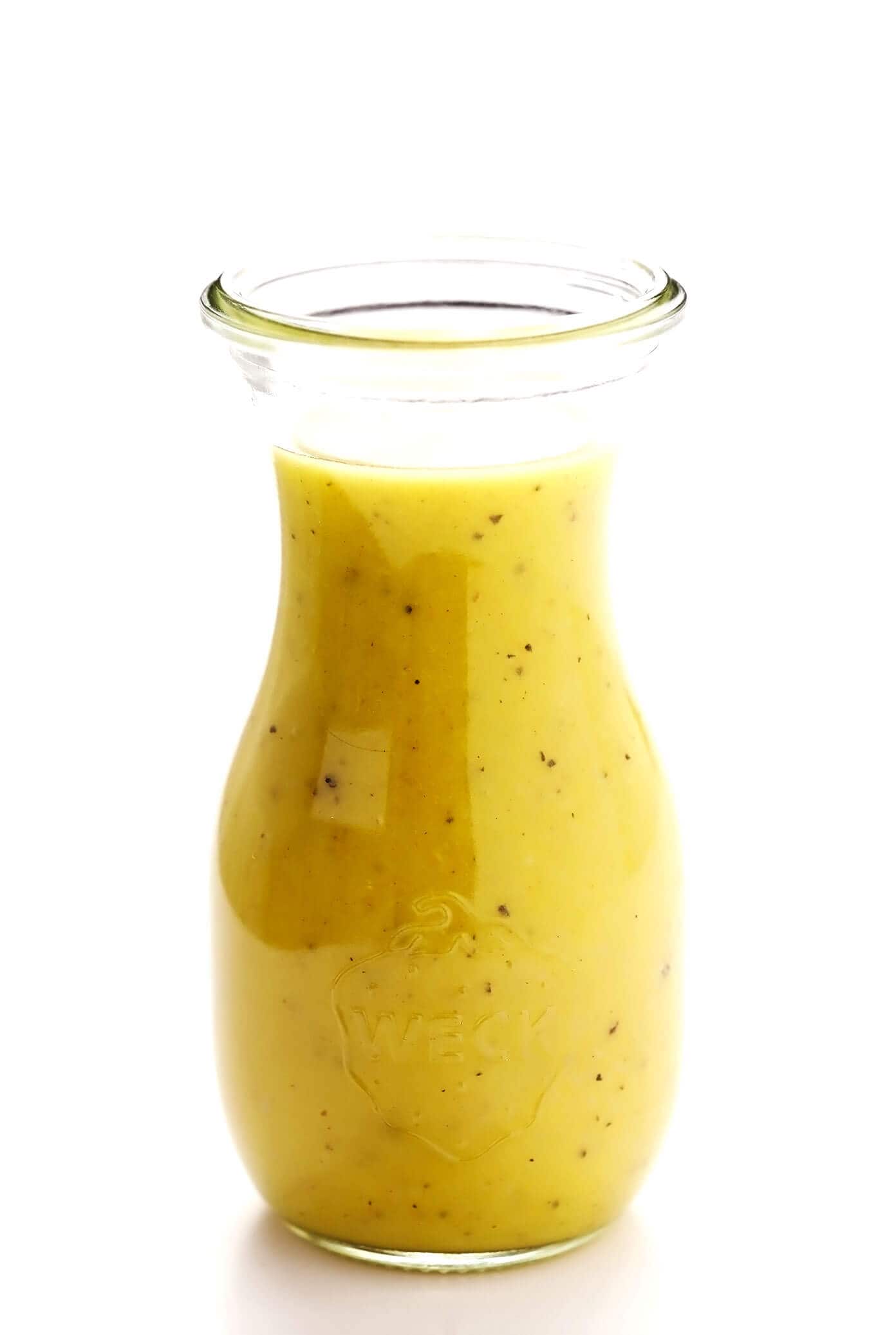 This basic salad dressing recipe is quick and easy to make, full of zippy fresh flavors, and versatile enough to go with just about any type of salad! You can opt to either make it with lemon juice or your choice of vinegar (to make it a vinaigrette), and feel free to add in extra herbs or sweetener too. | gimmesomeoven.com #salad #dressing #lemon #vinaigrette #glutenfree #vegan #healthy #vegetarian #mealprep Lemon Salad Dressing In Jar