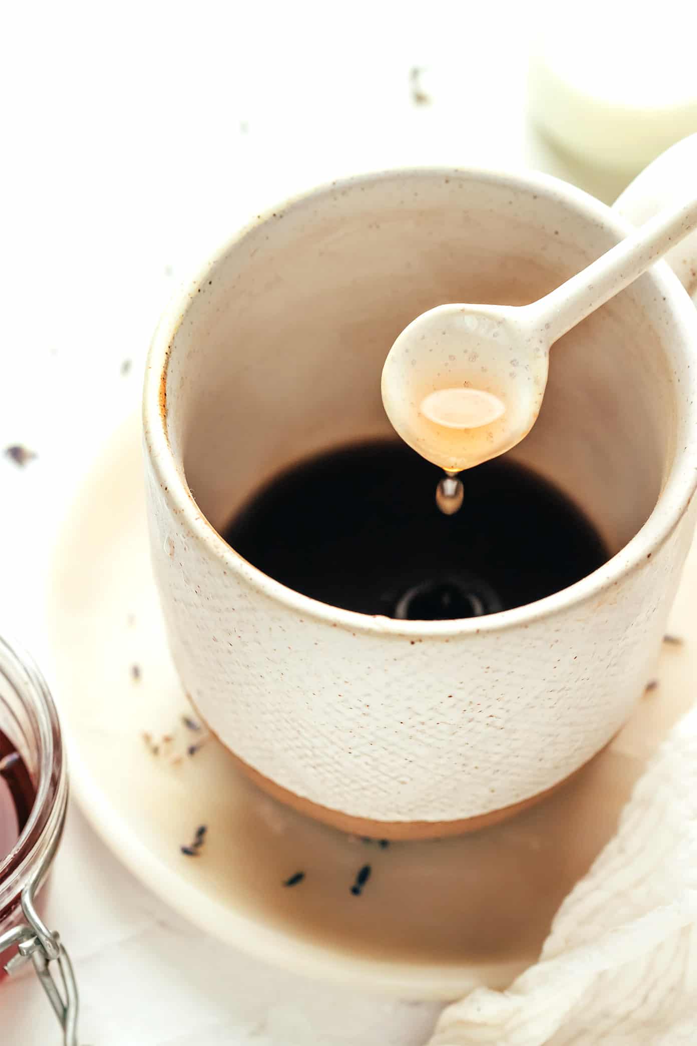 This homemade lavender latte recipe can be made hot or iced and is easy to customize with your favorite milk, espresso and add-ins. So delicious and less expensive than the coffee shop version! | gimmesomeoven.com How to make a lavender latte