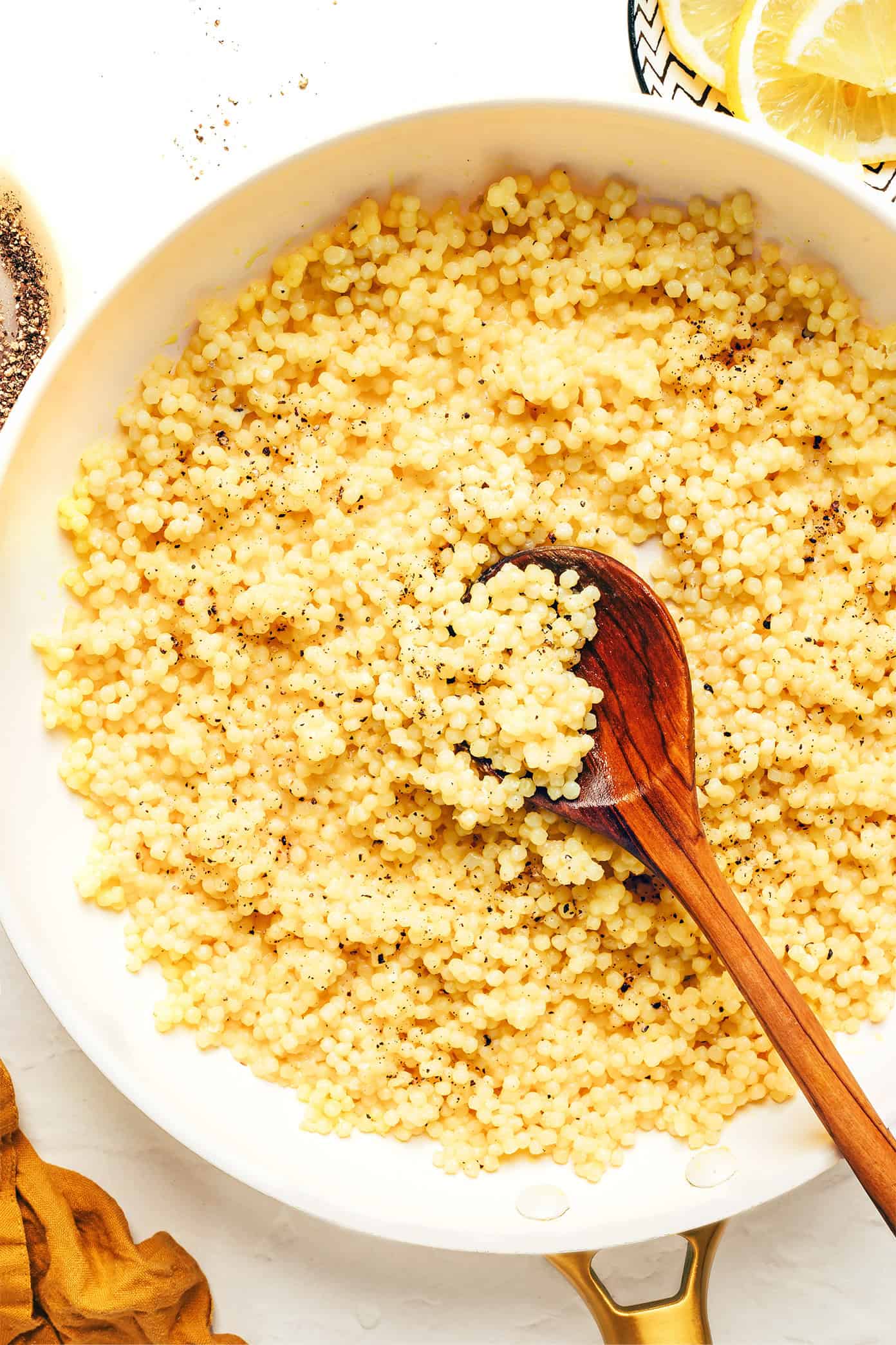 This lemon Parmesan pearl couscous recipe is a simple, versatile, and delicious side dish that pairs beautifully with everything from roasted veggies to grilled meats and more. | gimmesomeoven.com Parmesan Pearl Couscous in Pan