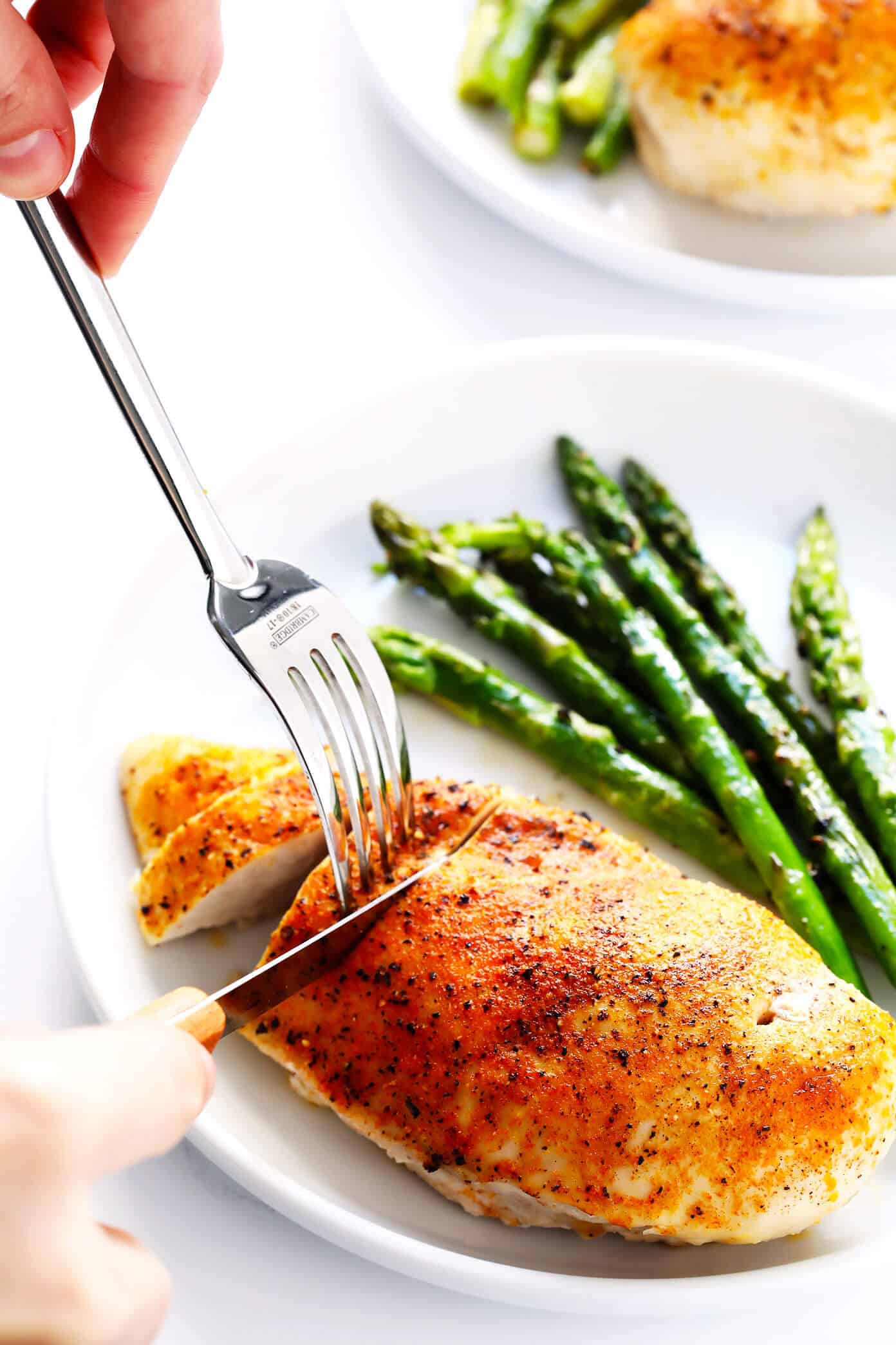 Learn how to make a PERFECT baked chicken breast -- delicious, juicy, tender, and fool-proof! Perfect for easy dinners, meal prep, or freezing for later. | gimmesomeoven.com #chicken #breast #dinner #mealprep #glutenfree Baked Chicken Breast with Roasted Asparagus