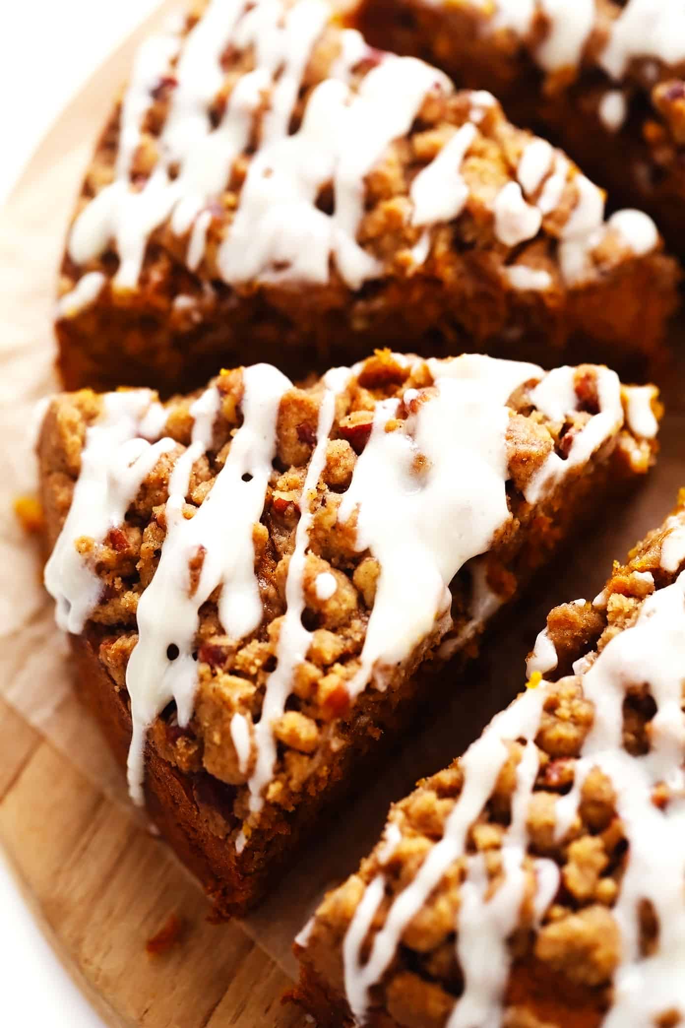 This pumpkin coffee cake is moist and perfectly spiced, then topped with a crunchy streusel crumb topping and a quick cream cheese drizzle. It's easy to make and the perfect breakfast or brunch treat for fall or the holidays! | gimmesomeoven.com Pumpkin Coffee Cake