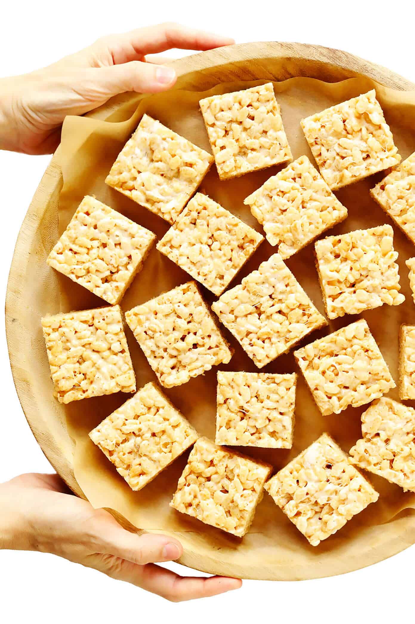 The classic 3-ingredient Rice Krispie Treats recipe is kicked up an irresistible notch with brown butter, toasted marshmallows, a splash of bourbon (if you'd like), and an extra pinch of sea salt. Always a delicious and nostalgic easy dessert recipe! | gimmesomeoven.com #ricekrispies #treats #cereal #dessert #vegan #treat #marshmallow Tray of Rice Krispie Treat Squares