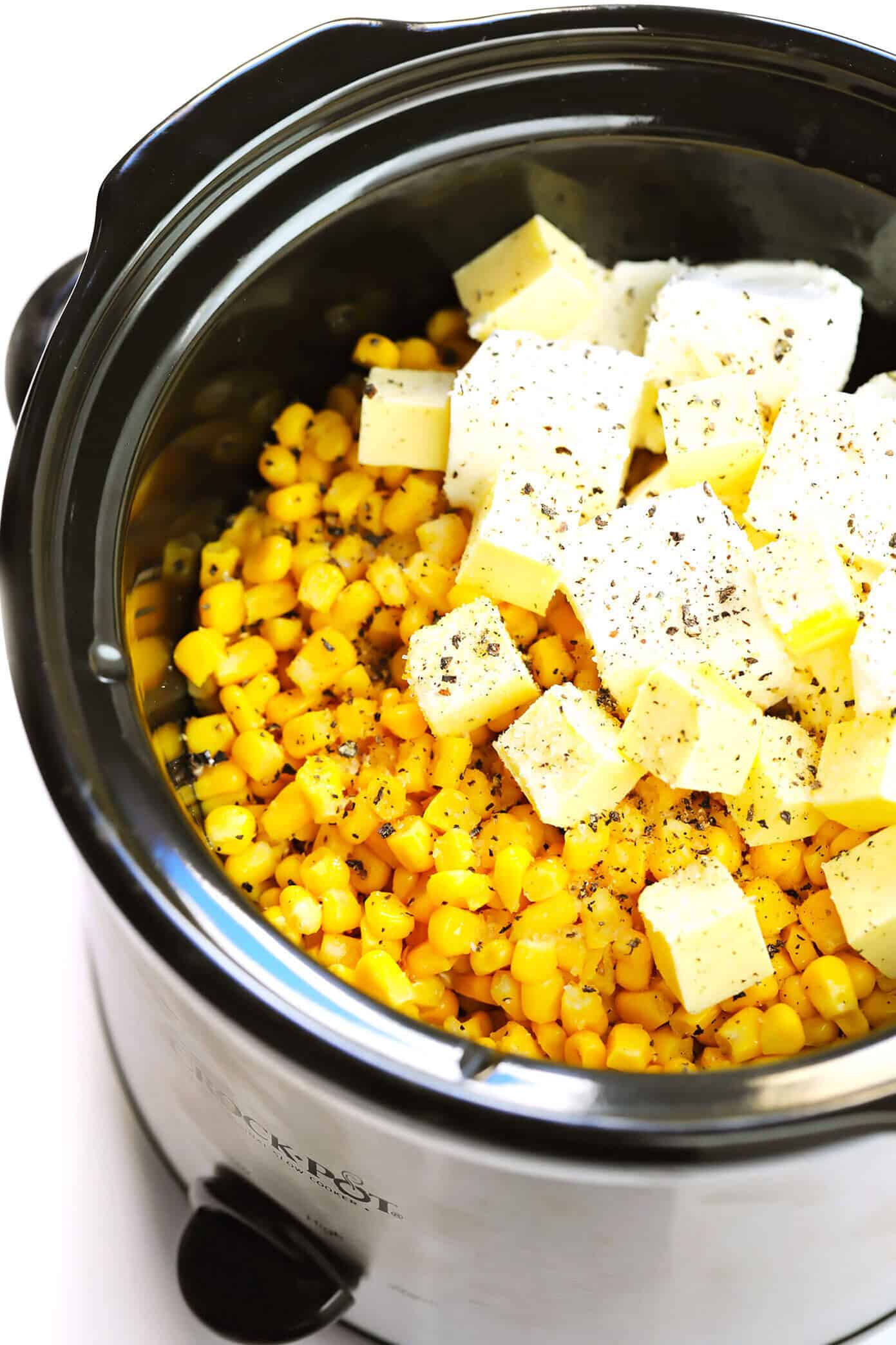 This slow cooker creamed corn recipe is super-easy to make in the Crock Pot (or on the stovetop), it's perfectly rich and creamy, and it's easy to customize with any of your favorite add-ins (herbs, cheese, etc). It's the throwback side dish that's always a crowd fave for Thanksgiving, Christmas, or anytime you're craving some classic comfort food. | gimmesomeoven.com #creamed #corn #thanksgiving #christmas #side #glutenfree #vegetarian #makeahead #crockpot #slowcooker Crock Pot Creamed Corn Ingredients