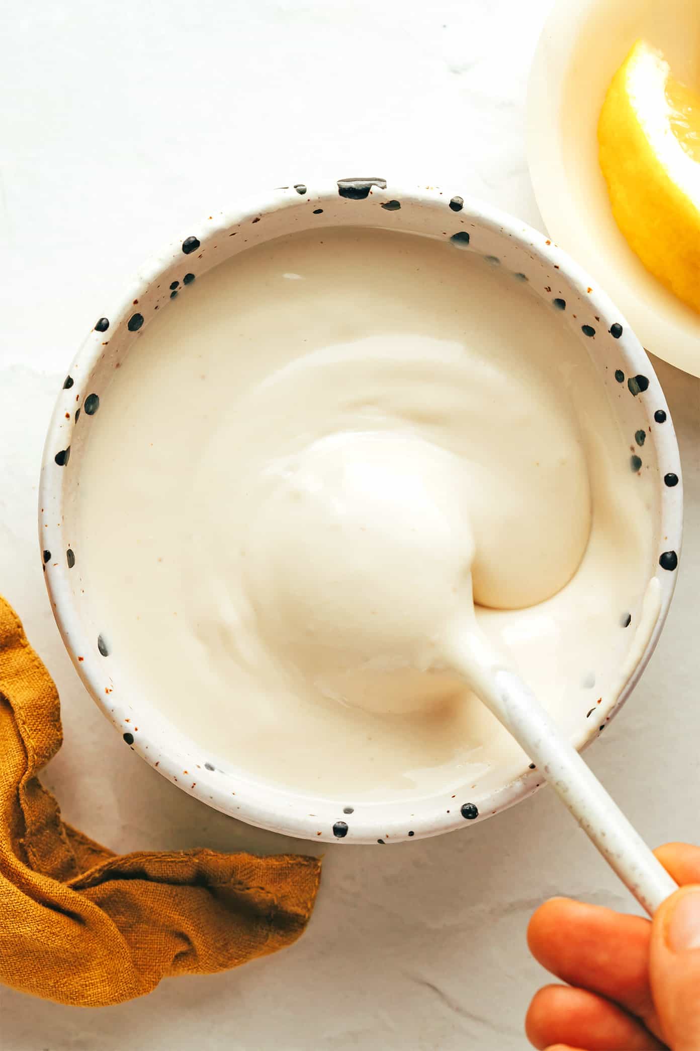 This homemade tahini sauce recipe is quick and easy to make with 5 ingredients and tastes amazing with everything from falafel to roasted veggies, grilled meats, wraps, salads and more. It's naturally gluten free and vegan, and easy to customize with extra herbs, spices or sweetener if you'd like. | gimmesomeoven.com Tahini sauce