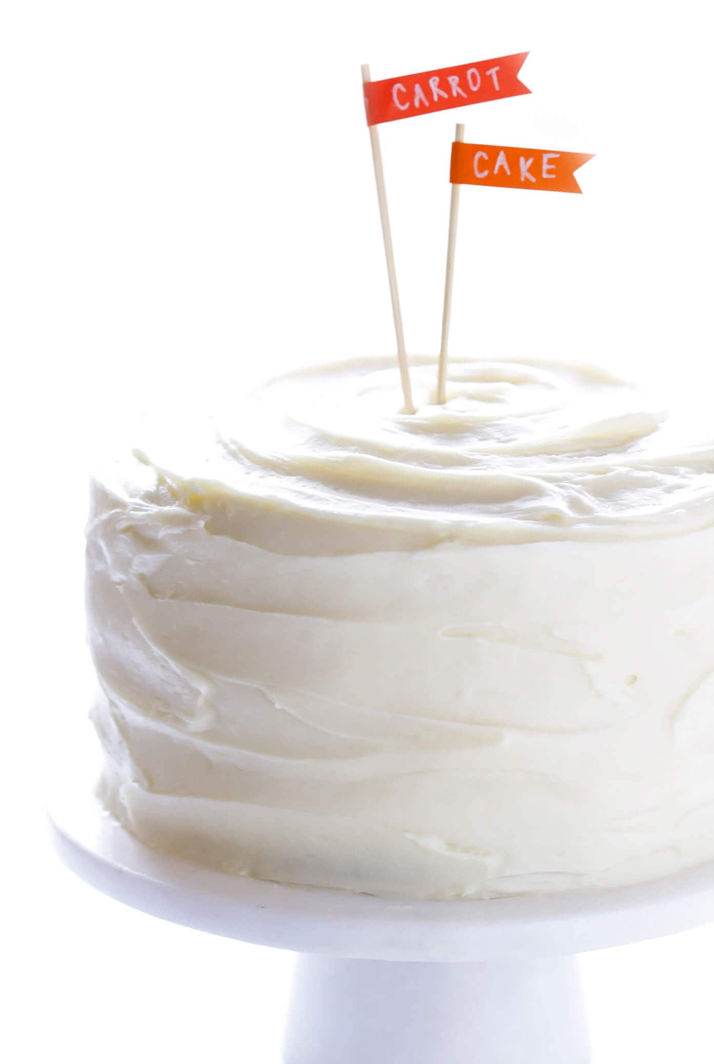 The BEST Carrot Cake Recipe! It's made with an easy homemade carrot cake (no mixer required) and the most heavenly cream cheese frosting. | gimmesomeoven.com #carrot #cake #dessert #easter #creamcheese #frosting #spring #vegetarian The BEST Carrot Cake with Cream Cheese Frosting