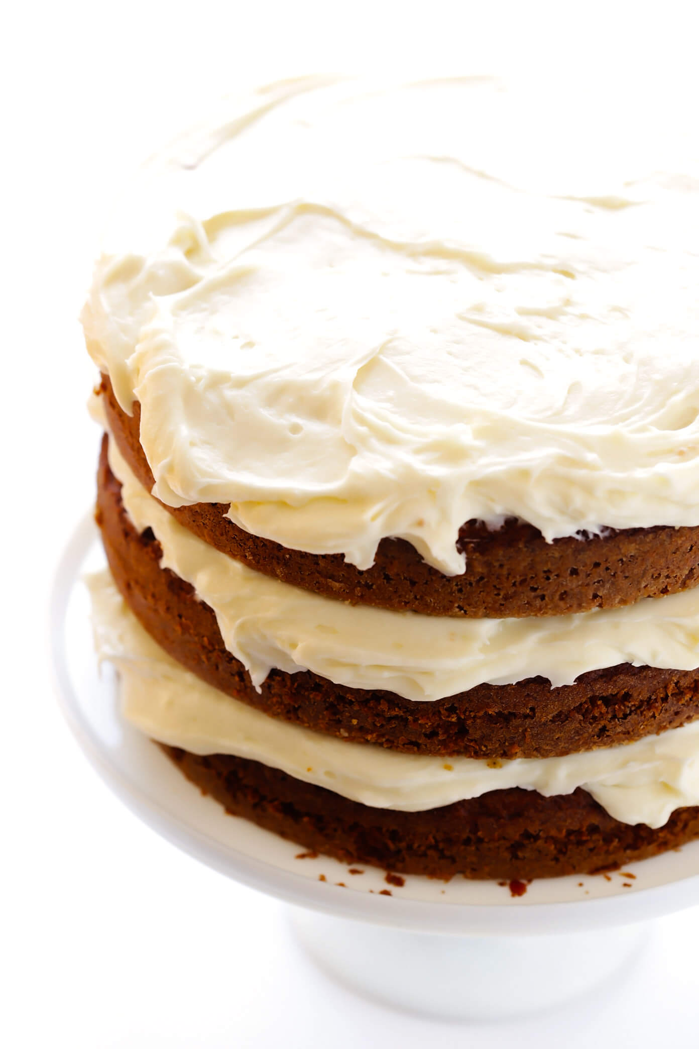 The BEST Carrot Cake Recipe! It's made with an easy homemade carrot cake (no mixer required) and the most heavenly cream cheese frosting. | gimmesomeoven.com #carrot #cake #dessert #easter #creamcheese #frosting #spring #vegetarian How To Make Carrot Cake