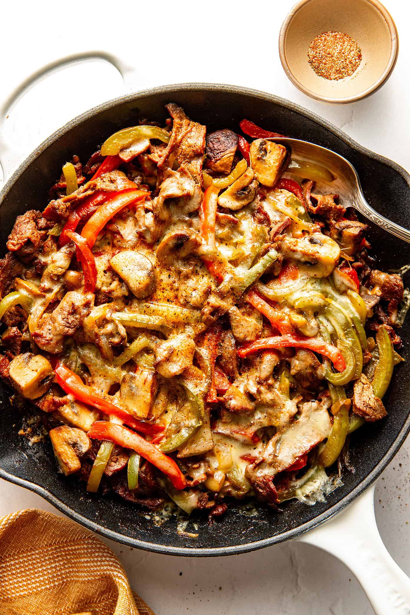 This zesty Philly cheesesteak skillet is a quick and easy one-pan recipe made with tender steak, sautéed veggies, melty provolone, and bold seasonings. Zesty Philly Cheesesteak Skillet from Gimme Some Oven